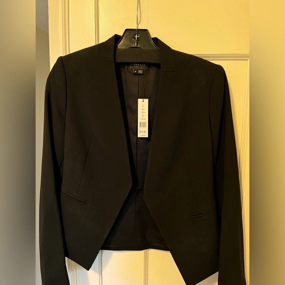 BNWT classic Theory black suit, ticket prices shown in USD. Offering in $CAD